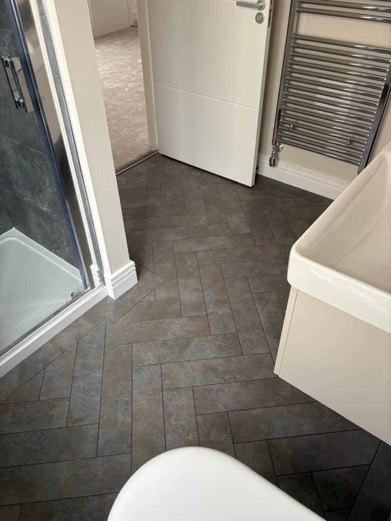 Bathroom herringbone tile floor