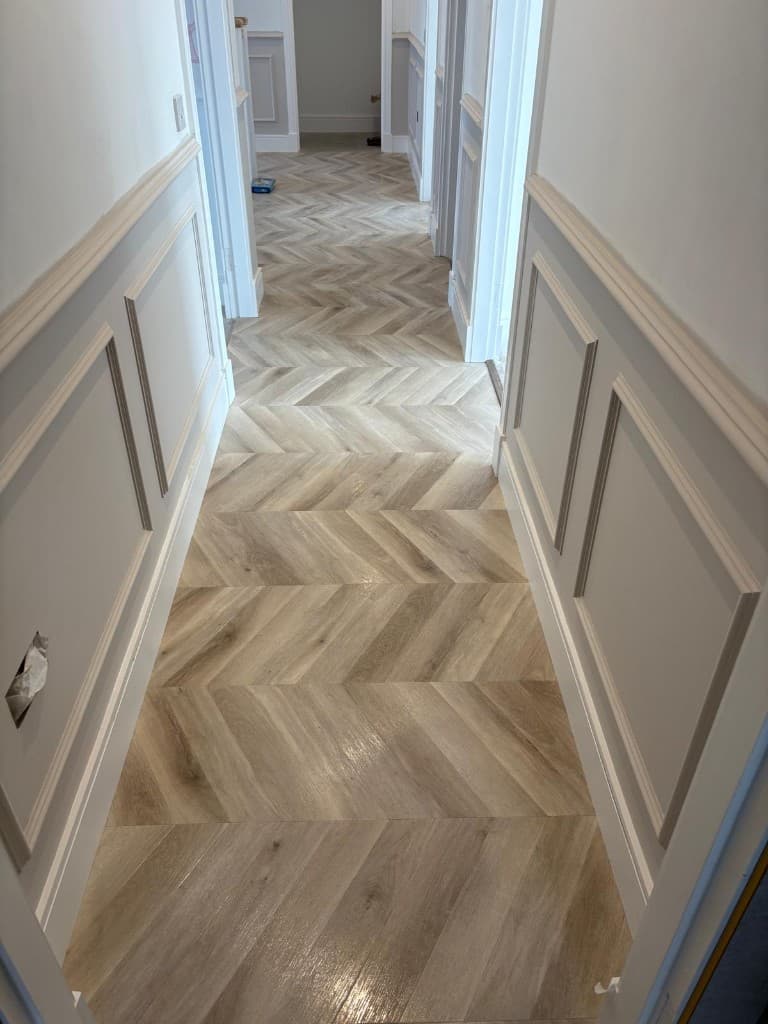 Chevron hallway with wall panelling